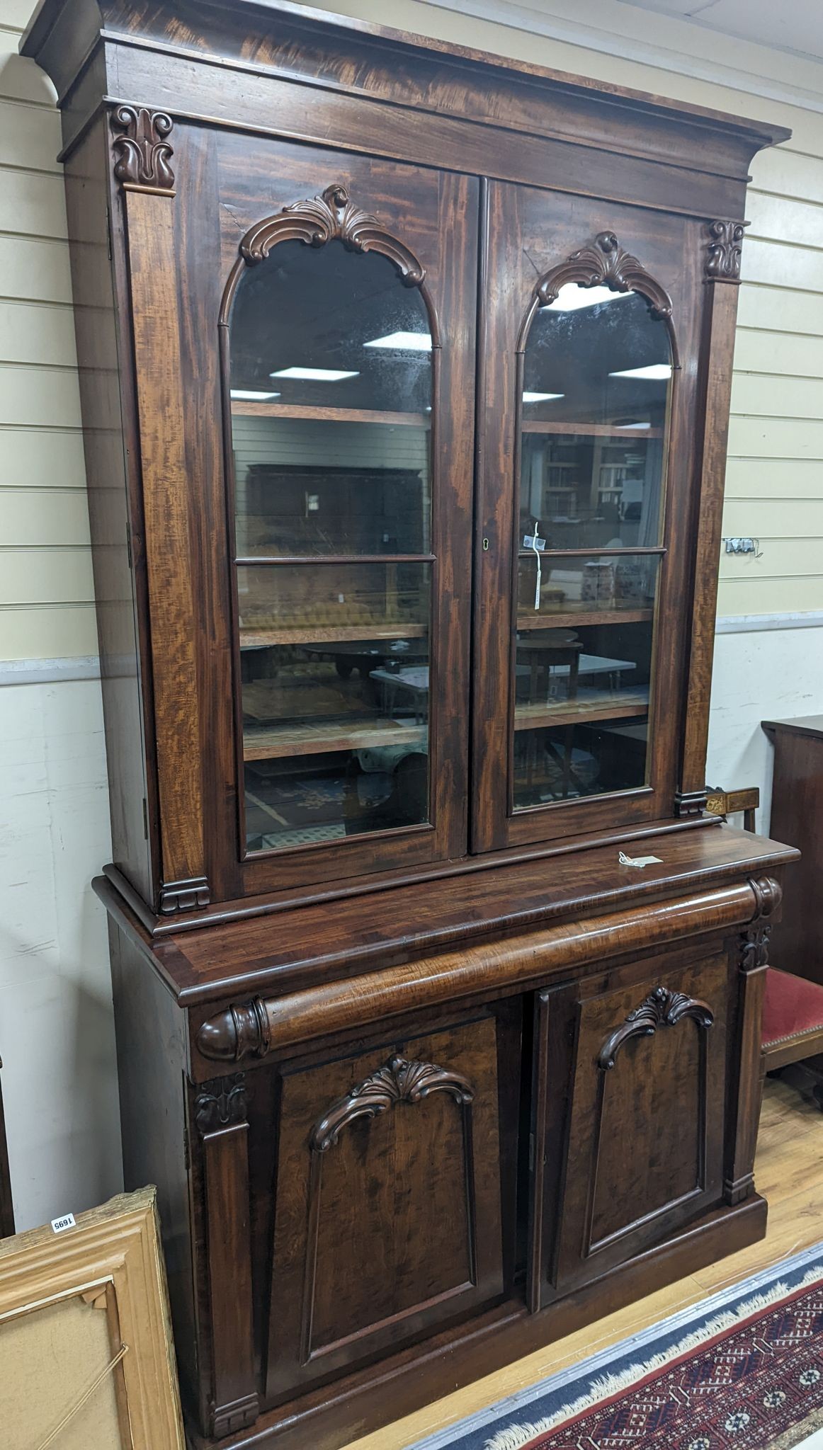 A mid Victorian mahogany bookcase, width 130cm, depth 54cm, height 230cm